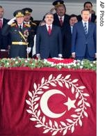 Turkey's new President Gul, center, PM Erdogan, right, and Chief of Staff Gen. Buyukanit, left, sing national a href=
