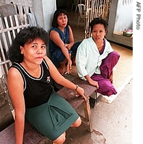 Indonesian sex workers at Jakarta's notorious Kramat Tunggak brothel complex wait outside one of the many bars (File)