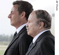 Algerian President Abdelaziz Bouteflika, right, and French President Nicolas Sarkozy listen national a href=