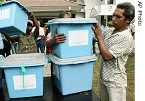 Election workers prepare a href=