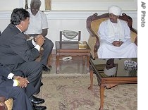 Bill Richardson, left, and President Omar Bashir, right, during a href=