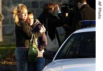 Susan Hylton (l) hugs her daughter, Mary McFillin - a student at Virginia Tech