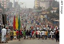 Protesters march during a a href=