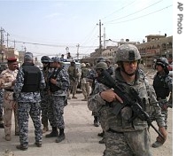 A US soldier keeps watch in a Shi'ite enclave of Sadr City in Baghdad, Iraq