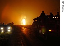 Smoke and flames from an explosion at a gas a href=