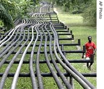 Man walks along oil a href=