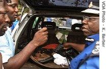 Police find stones and other objects that could be used as weapons in the back of a vehicle at a polling sight in Freetown, Sierra Leone, 08 Sep 2007