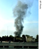 Smoke rises from Lal Masjid during heavy gunbattle between Pakistan troops and militants in Islamabad, 10 July 2007