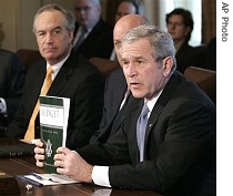 President Bush, right, holds up copy of a href=