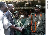 Joseph Kony, leader of LRA (right)with Ugandan a href=