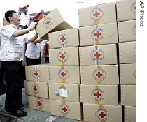 South Korean workers from Korea Red Cross prepare aid supply a href=