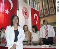 Independent candidate Aysel Tugluk  stands before completing a href=