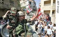 Lebanese soldier holding child, waves to a href=