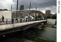 Kosovo Police patrol on the main bridge of the a href=