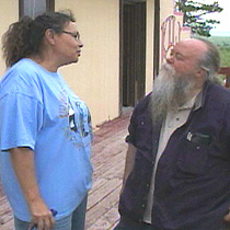 Melanie Janis and Business Manager Tom Casey on the station's porch