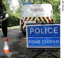 Police close off a road to Hunts Hill Farm where a precautionary a href=