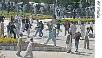 Protesters throw stones at police during anti- government rally in Islamabad, 16 a href=