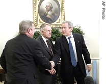 President Bush, right, shakes hands with Sen. Richard Durbin, D-Ill., left, as Democratic Senate leader Sen. a href=