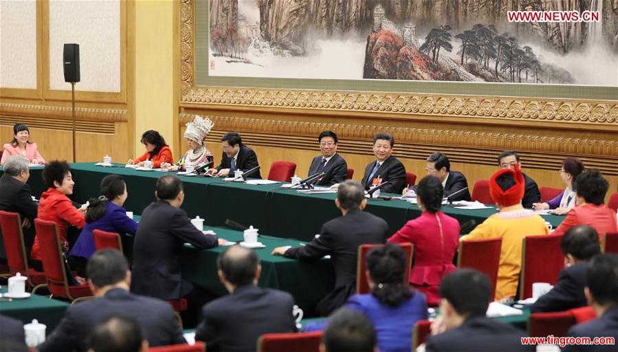 Chinese President Xi Jinping joins a group deliberation of deputies from Hunan Province to the annual session of the National People