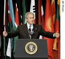 President Bush gestures as he speaks to members of the a href=