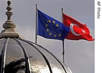 Flags of Turkey, (l), and the European Union fly over a href=
