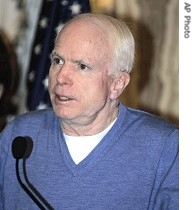 Sen. John McCain talks to reporters in Baghdad, 14 Dec. 2006