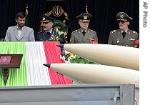 President Mahmoud Ahmadinejad, left, reviews army missiles during parade a href=