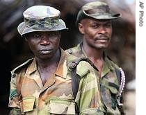 Two Nigerian army soldiers stand guard in Ikang, near Calabar in the Niger a href=