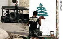 A Lebanese soldier paints a href=