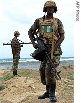 Africa Union soldiers secure the area where they prepare to destroy weapons and a href=