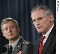 Principal Deputy Under Secretary of Defense for Policy Ryan Henry, right, and Lt. Gen. Walter Sharp, Director of the a href=