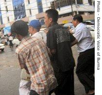 Ohn Than is arrested by Burmese authorities shortly after staging a solo protest against the military government, outside the U.S. embassy in Rangoon, 23 Aug 2007