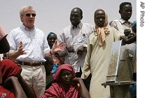 John Holmes inspects a water pump in the Es Sallam refugee camp, northern Darfur, 25 a href=