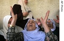 Family members mourn during the funeral procession of Mahmoud Sabah, a Hamas a href=