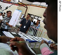 An electoral worker shows a a href=