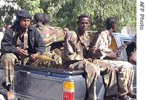 Somali police forces patrolling amid heavy clashes between security forces and suspected Islamist a href=