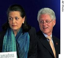 Former President Clinton, right, and Indian Congress Party President Sonia Gandhi during a href=