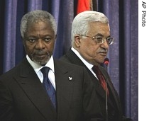 Palestinian Authority President Mahmoud Abbas, right, walks past UN Secretary-General Kofi Annan as they arrive for a a href=