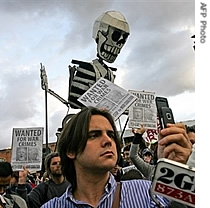 Anti-Bush protesters take part in a a href=