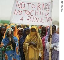 Sudanese refugee woman hold a sign saying no to a href=