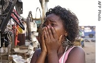 Maputo resident reacts after blast at arms depot, 23 a href=