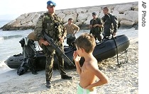 UNIFIL Spanish soldier holding M60 machine gun stands guard near navy a href=